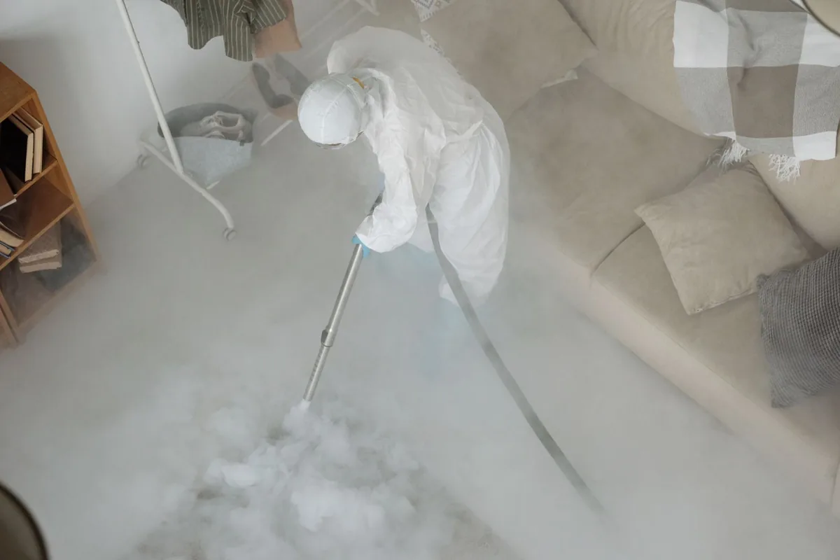 Biohazard cleanup technician in protective equipment, Orangecrest, Riverside, CA